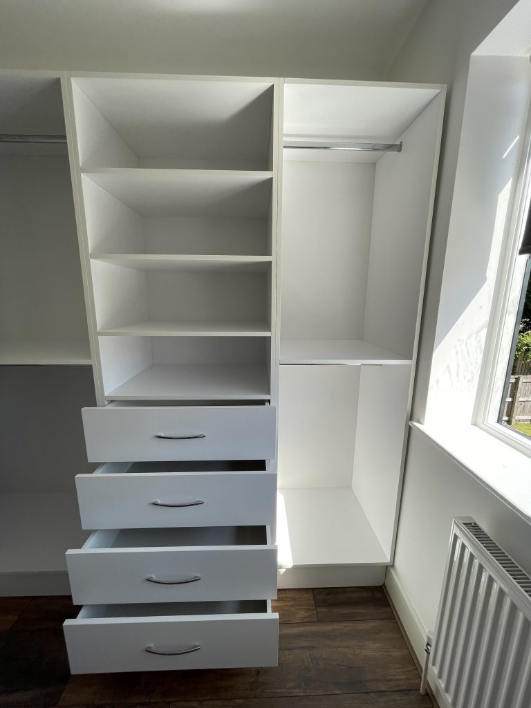 Bespoke fitted wardrobe with smart storage and a clean, modern design
