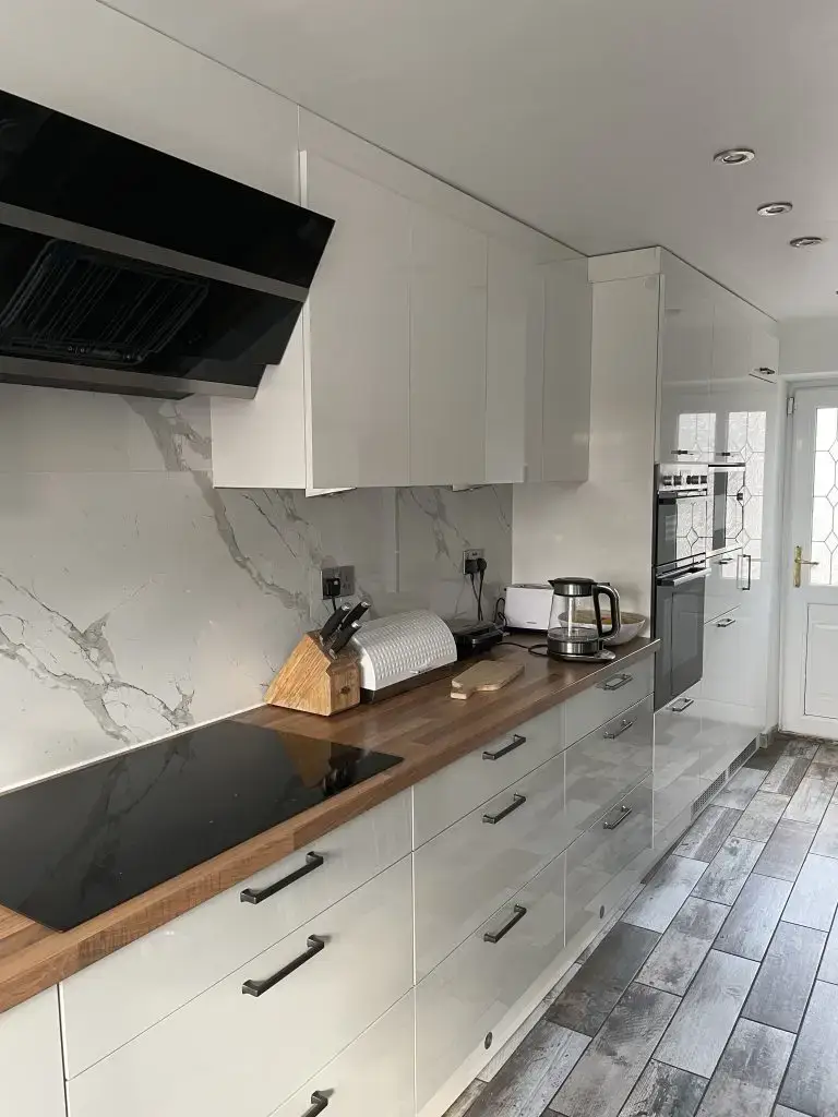 Modern kitchen installation with wooden worktop in St. Helens
